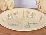 a picture of a plate with a picture of people on it