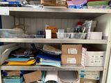 many boxes and boxes on the shelves in the closet