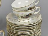 a lot of plates and cups on the table