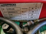 an image of a close up of a hose connected to a machine