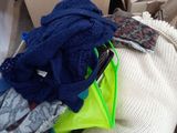 a pile of clothes that is sitting on the ground