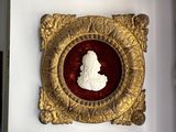 a gold frame with a picture of a man on it