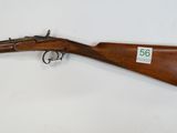 a rifle with a wooden barrel on a white background