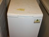 a white washer and a dryer in a small room