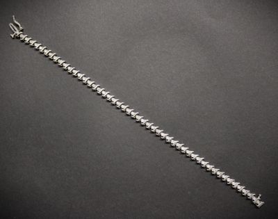 Bracelet rivière en or gris 585°°°, alternant maillons dessi…