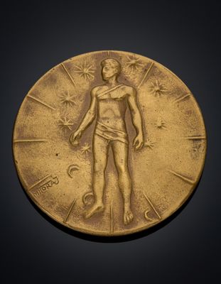 a close up of a gold medal on a black background