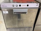 silver dishwasher sitting on pallets in a warehouse area