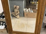 a mirror with a picture of a man in it