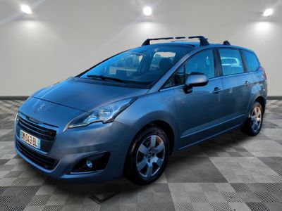 the blue car is parked in a room with a checkered floor