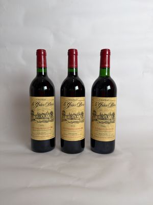 three bottles of wine sitting on top of a table next to each other