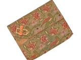 a small pouch with a flower pattern on it