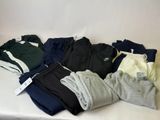 a pile of men ' s clothing on a white table