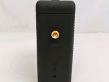 an image of a black cell phone with a gold button