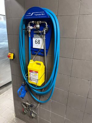 a blue hose attached to a wall in a bathroom