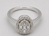a close up of a diamond ring on a white background