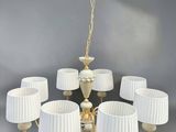 an image of a chandelier with eight lamps and a white shade