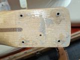 a close up of a piece of wood with holes in it