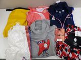 a lot of clothes that are on a table