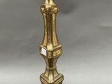 an antique brass table lamp with a glass shade on top