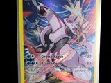 the pokemon card is displayed on a stand with a black background