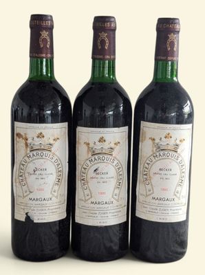 three bottles of wine sitting on top of a table next to each other
