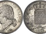 a silver coin with a crown on top of it