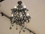 a chandelier hanging from the ceiling in a room