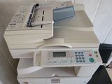 a white printer sitting on top of a black and white printer