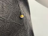 a ring that is sitting on top of a piece of paper