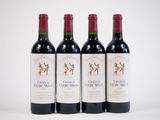 three bottles of red wine sitting next to each other on a white surface