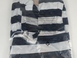 a black and white striped shirt in a plastic bag