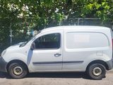 a white van that is parked in the parking lot