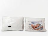 two pillows with a picture of a man in a bathing suit on them
