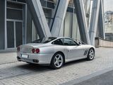 a silver sports car parked on the side of the road