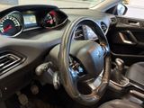 dashboard of a small car with a steering wheel and gauges