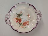 a plate with a floral design on it on a table