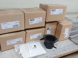 a pile of boxes sitting on a pallet next to a coffee cup