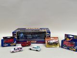 a box of assorted toy vehicles and a box of other toy vehicles