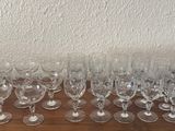 many empty wine glasses sitting on a wooden table