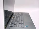 two laptops that are open on a white surface