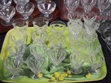 a lot of empty glasses on a tray on the table
