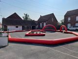 a large inflatable area in the middle of a parking lot