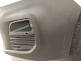 a close up of the front bumper of a car with a hole in it