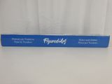 a blue box of toothpaste sitting on top of a white table