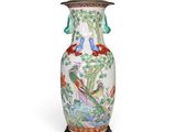 an image of a vase with birds and flowers painted on it