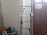 a ladder that is leaning against a wall in a room