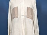 an image of a white shirt on a mannequin mannequin stand