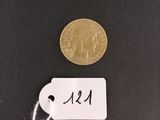 a close up of a coin with a tag attached to it