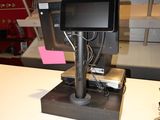 an image of a small pos terminal on a counter