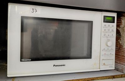 a white microwave sitting on top of a counter